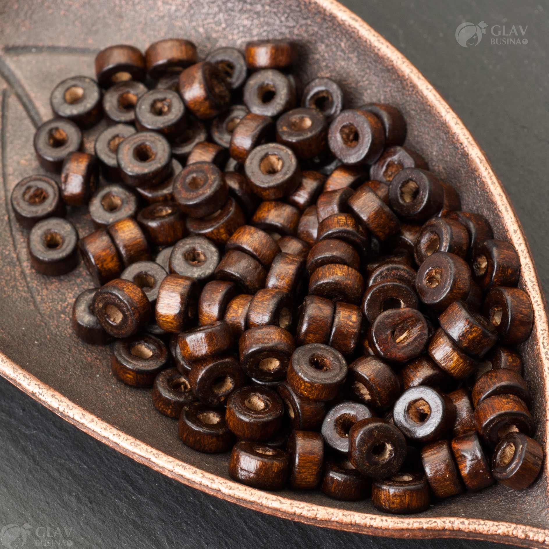 Бусины деревянные коричневые полуглянцевые, размер 6x3мм, отверстие 2мм, используются в бижутерии и рукоделии.