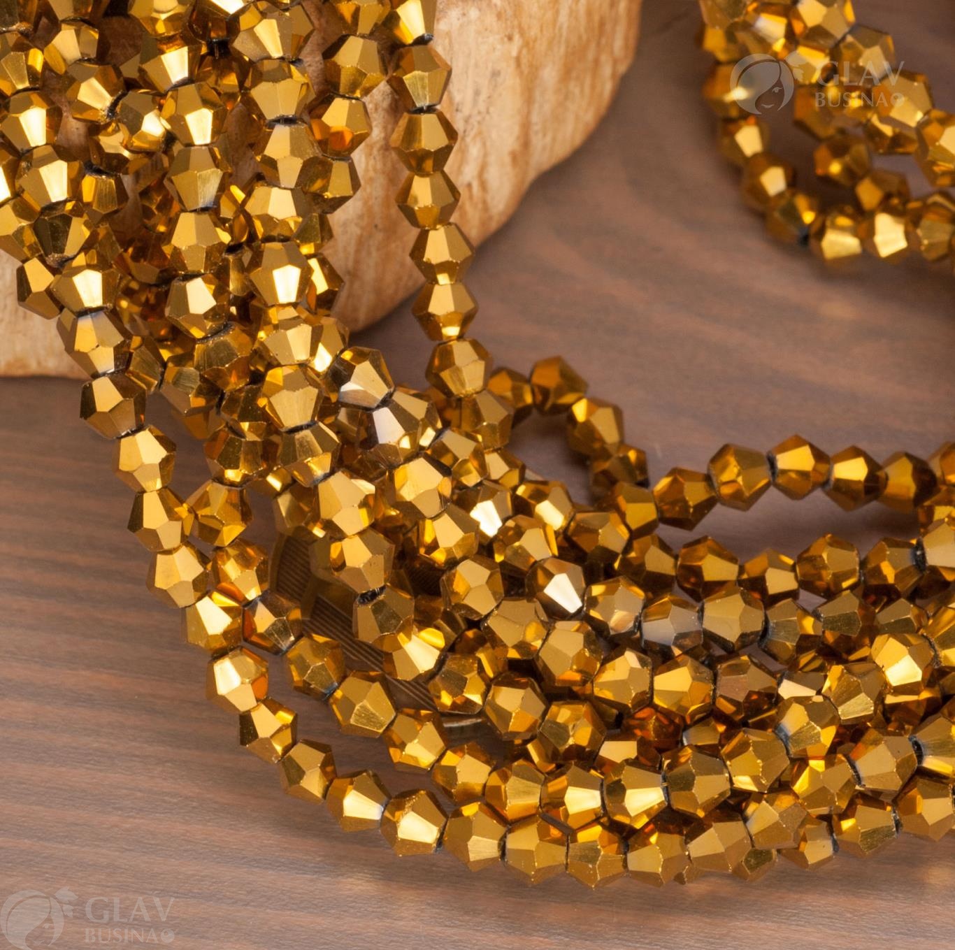 Нитка непрозрачных стеклянных бусин-биконусов золотого цвета, 92 шт., длина 36 см, размер 4.5x4мм, отверстие 1мм.